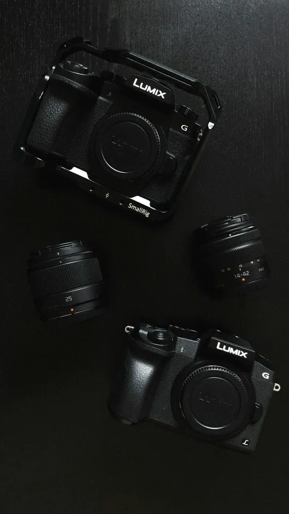 Dark image of Lumix camaras lying on a table